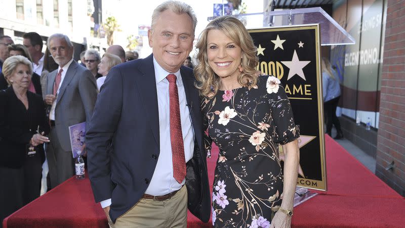 Pat Sajak, left, and Vanna White, from “Wheel of Fortune,” attend a ceremony honoring Harry Friedman with a star on the Hollywood Walk of Fame on Nov. 1, 2019, in Los Angeles.
