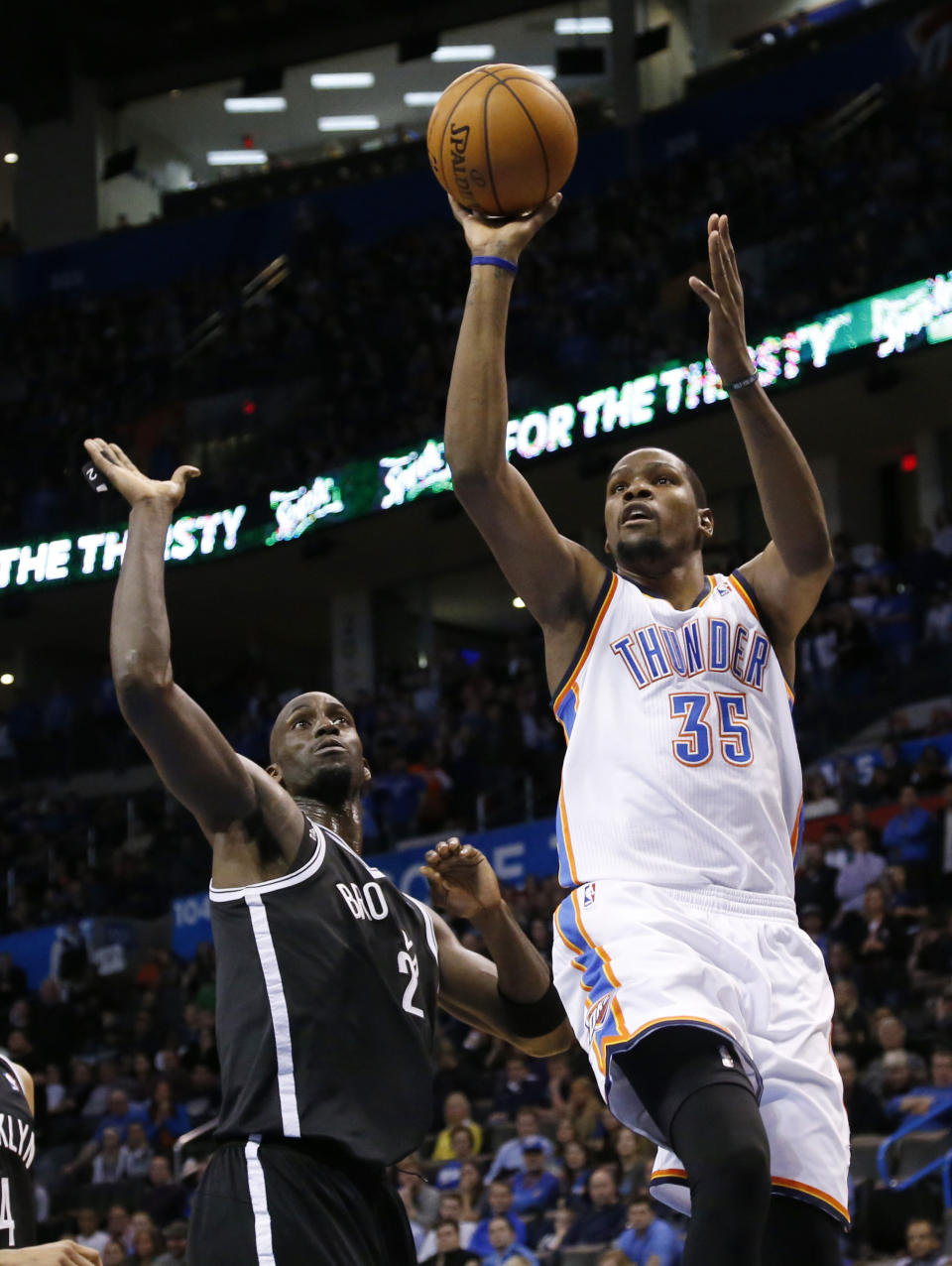 Oklahoma City Thunder forward Kevin Durant (35) shoots in front of Brooklyn Nets center Kevin Garnett (2) during an NBA basketball game between the Brooklyn Nets and the Oklahoma City Thunder in Oklahoma City, Thursday, Jan. 2, 2014. (AP Photo/Sue Ogrocki)