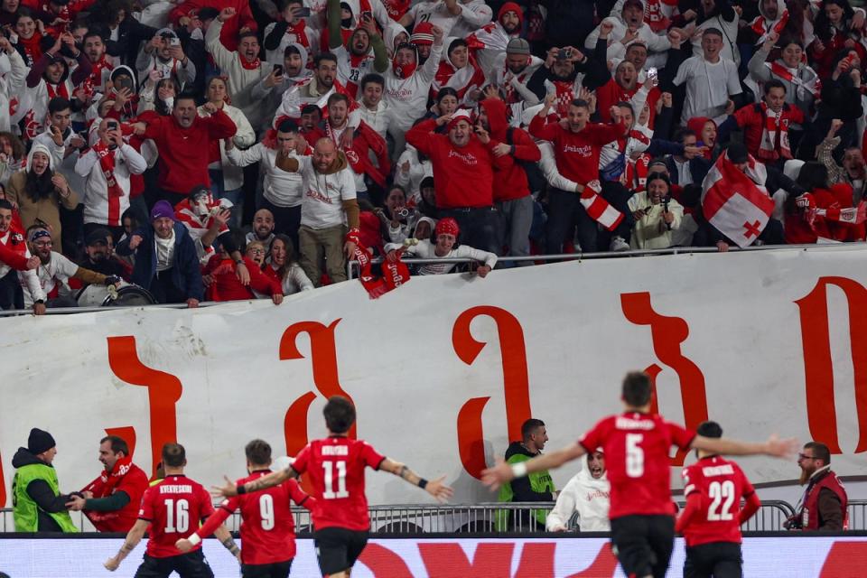 Georgia’s players celebrate after qualifying for Euro 2024 (AFP via Getty Images)