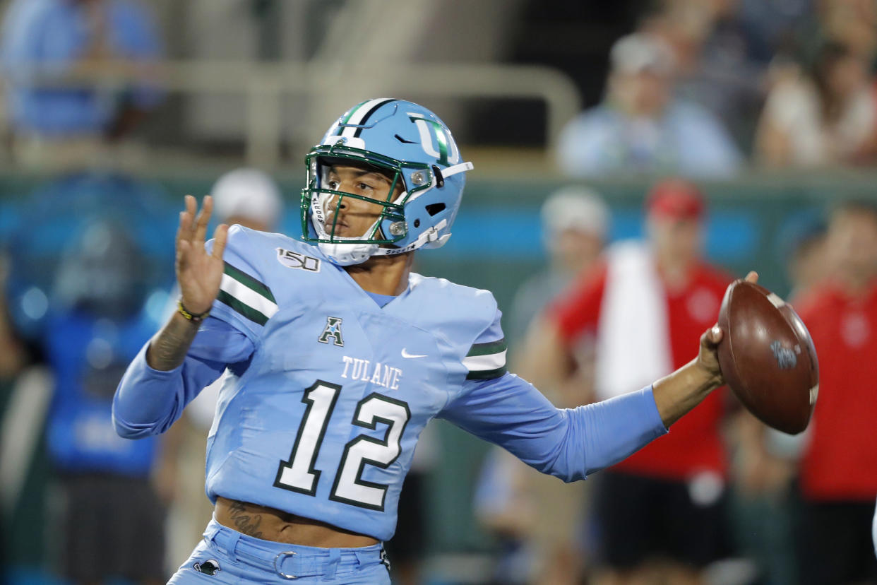 Tulane quarterback Justin McMillan throws a pass during the first half of the team's NCAA college football game against Houston in New Orleans, Thursday, Sept. 19, 2019. (AP Photo/Gerald Herbert)