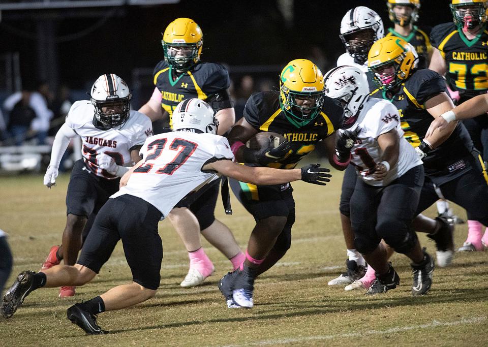 Catholic's Nigel Nelson (No. 23) runs at will against the West Florida defense during the Crusaders' senior night home game on Friday, Oct. 27, 2023.
