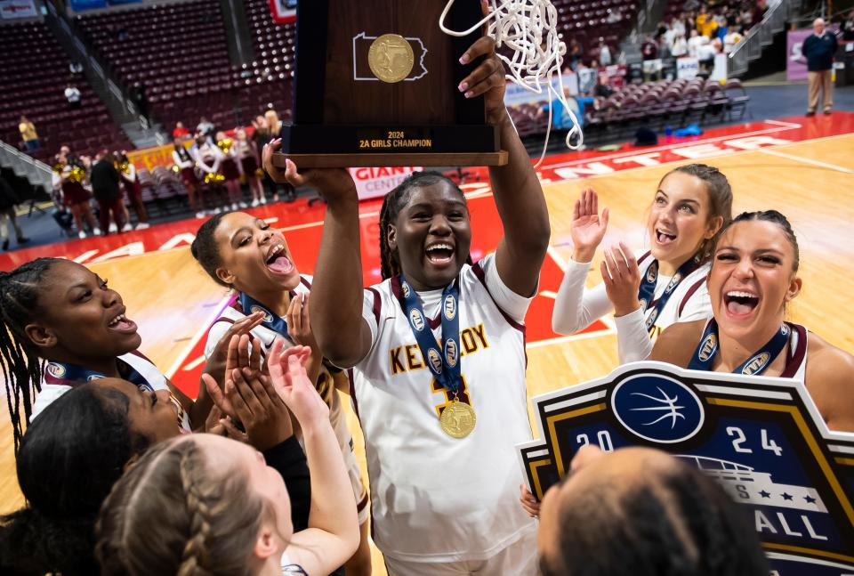 The Kennedy Catholic Golden Eagles celebrate on the court after defeating Marion Center 42-40 in the PIAA Class 2A Girls Basketball Championship at the Giant Center on Thursday in Hershey.