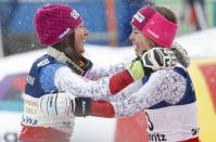 Alpine Skiing - FIS Alpine Skiing World Championships - Women's Alpine Combined - St. Moritz, Switzerland - 10/2/17 - Wendy Holdener of Switzerland is hugged by silver medalist Michelle Gisin of Switzerland (R) after winning the gold medal in the Alpine Combined. REUTERS/Denis Balibouse TPX IMAGES OF THE DAY - RTX30G80