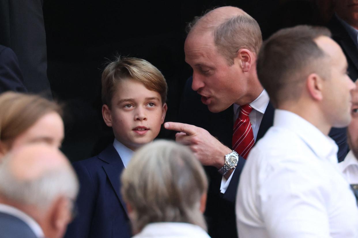 Patron of the Welsh Rugby Union Britain's Prince William, Prince of Wales (CR) talks with his son Prince George of Wales (CL) during the France 2023 Rugby World Cup quarter-final match between Wales and Argentina at the Stade Velodrome in Marseille, south-eastern France, on October 14, 2023.