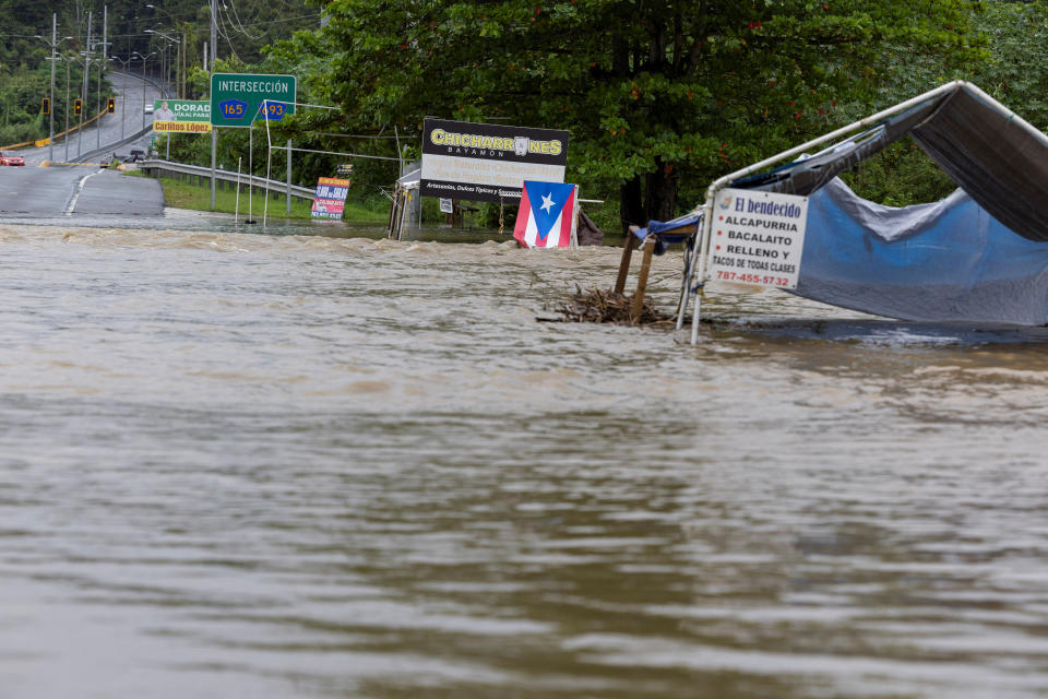 A bridge submerged by the flooded La Plata River is seen after Tropical Storm Ernesto in Toa Baja, Puerto Rico, August 14, 2024. REUTERS/Ricardo Arduengo