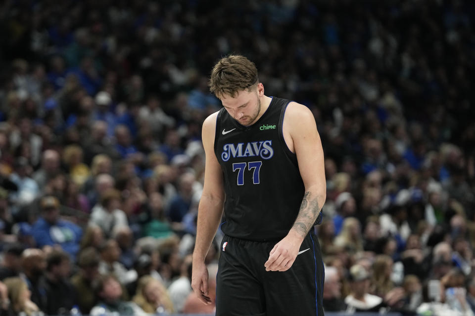 Dallas Mavericks guard Luka Doncic walks up court slowly during the second half of an NBA basketball game against the Cleveland Cavaliers in Dallas, Wednesday, Dec. 27, 2023. (AP Photo/LM Otero)