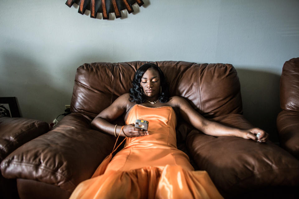 <p>Claressa “T-Rex” Shields waits to be picked up by her boyfriend before her senior prom in Flint, Michigan. This is nearly a year after winning the Olympic Gold Medal in Women’s Boxing at the 2012 Summer Games in London. (Photograph by Zackary Canepari) </p>