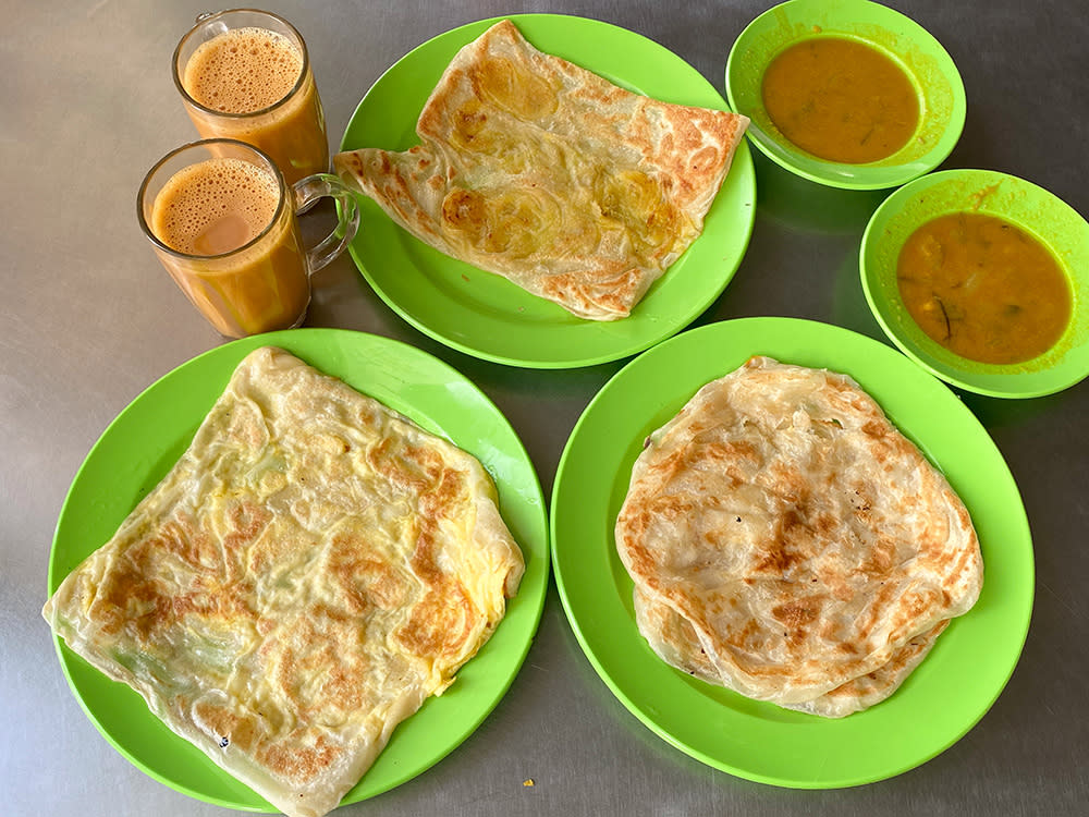 Start the day with fluffy soft 'roti canai', 'roti pisang' and 'roti telur' with 'teh tarik' from Subang Jaya's Fawwaz that has reopened after a long hiatus. — Pictures by Lee Khang Yi