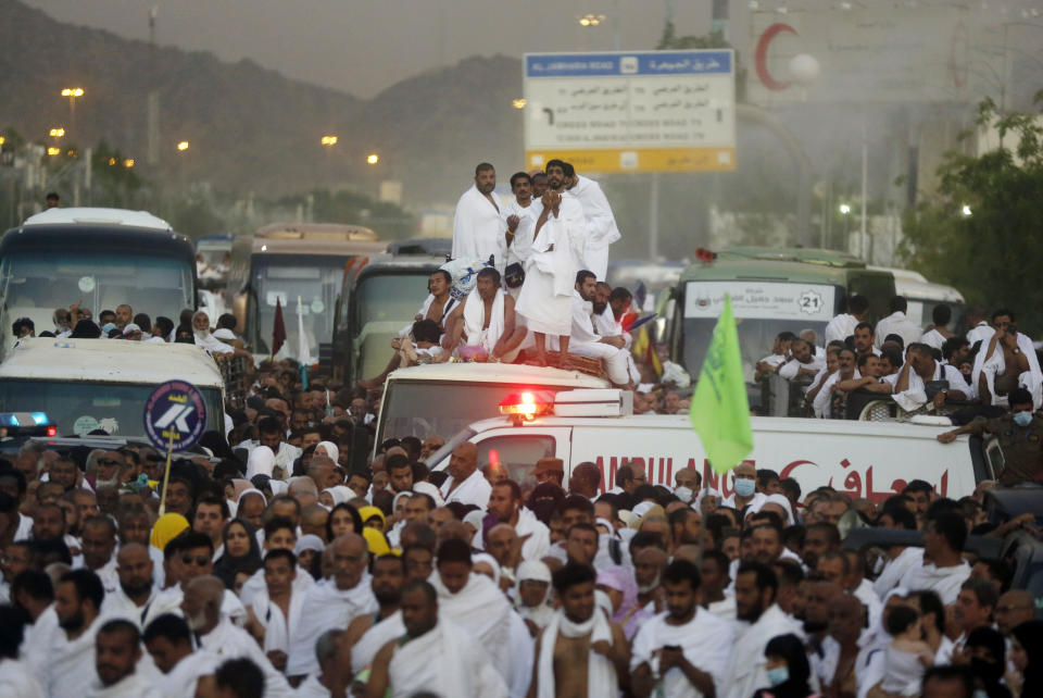 Muslim pilgrims pray as they prepare to leave Arafat on their way to Muzdalifah during the annual Hajj pilgrimage, near the holy city of Mecca, Saudi Arabia, Saturday, Aug. 10, 2019. More than 2 million Muslims gathered at the sacred hill of Mount Arafat in Saudi Arabia on Saturday for an intense day of worship and reflection on what's considered the climax of the Islamic hajj pilgrimage. (AP Photo/Amr Nabil)