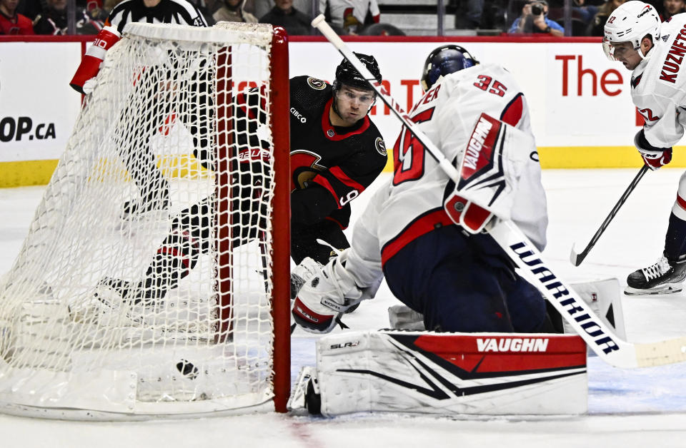 Ottawa Senators centre Josh Norris (9) scores a goal on Washington Capitals goaltender Darcy Kuemper (35) during first period of an NHL hockey game in Ottawa, Ontario, on Wednesday, Oct. 18, 2023. (Justin Tang/The Canadian Press via AP)