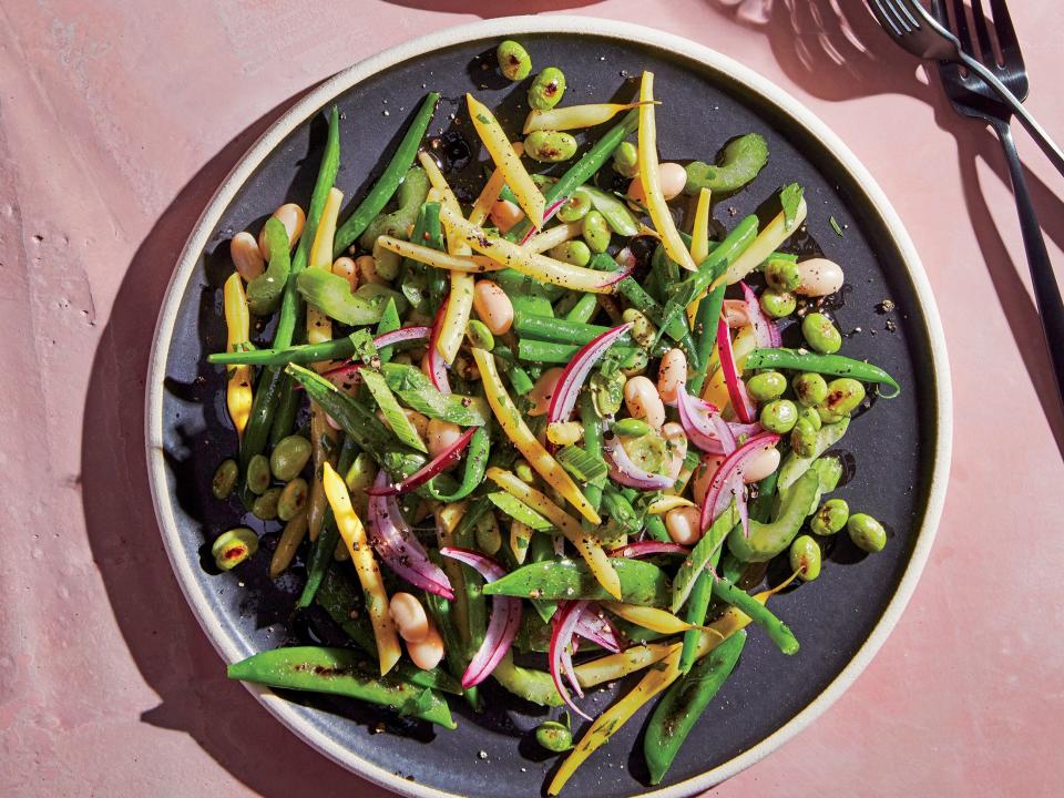 <p>We’ve updated the tired three-bean staple with a wonderful variety of textures, colors, and shapes. It’s a gorgeous salad that you’ll be proud to serve at your next backyard barbecue. Charring the snap peas and edamame adds robust flavor notes that complement the zip of the dressing and the mild taste of the green beans.</p> <p><a href="https://www.myrecipes.com/recipe/four-bean-and-one-pea-salad" rel="nofollow noopener" target="_blank" data-ylk="slk:Four Bean (and One Pea) Salad Recipe;elm:context_link;itc:0;sec:content-canvas" class="link ">Four Bean (and One Pea) Salad Recipe</a></p>