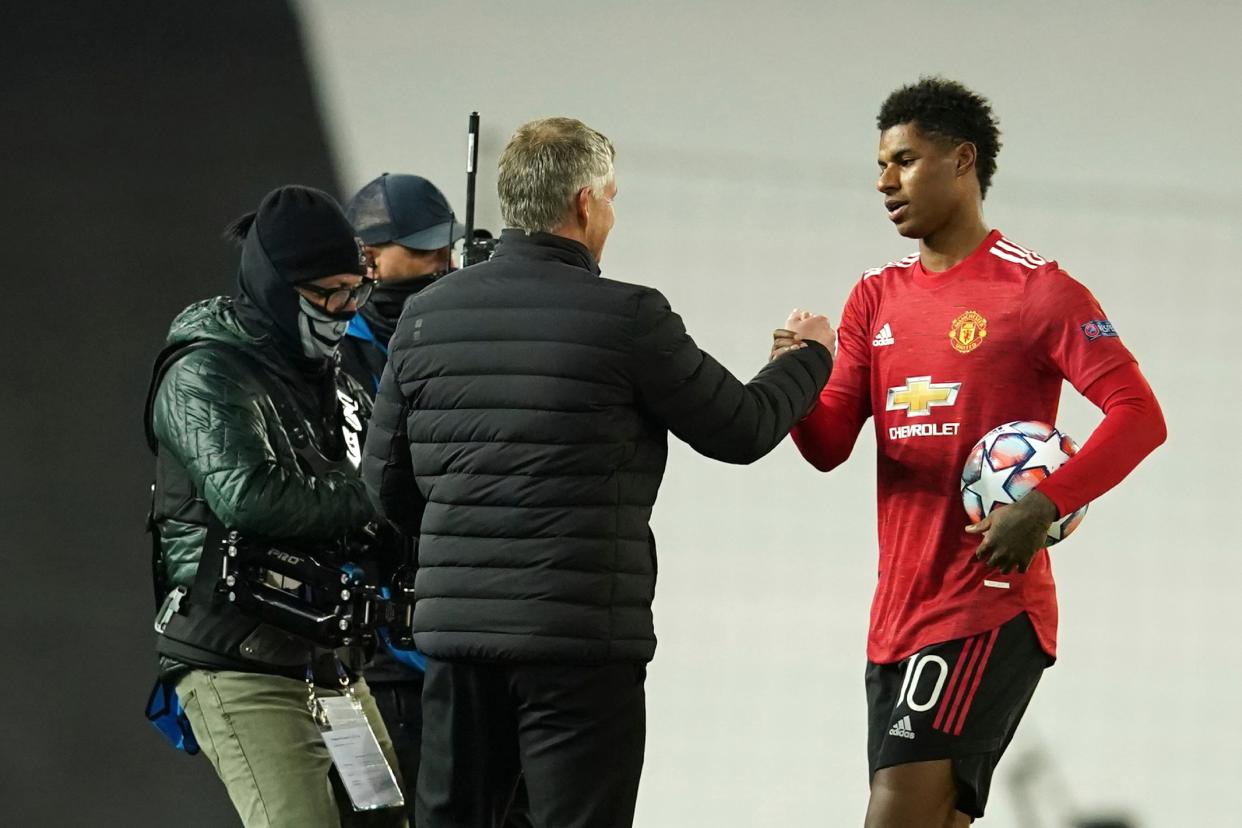 Marcus Rashford is congratulated by Ole Gunnar Solskjaer (AP)