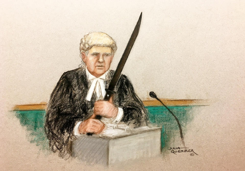 Prosecutor Timothy Cray shows Old Bailey jury the samurai sword allegedly recovered from defendant Mohiussunnath Chowdhury near Buckingham Palace. (SWNS)