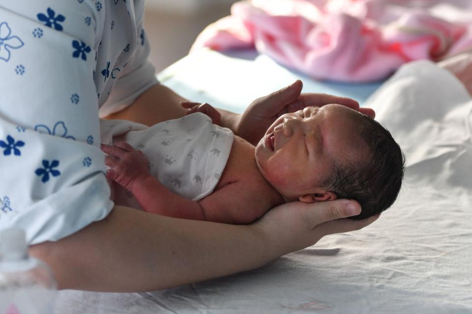 A nurse takes care of a newborn baby at a hospital in Fuyang, in China's eastern Anhui province on January 17, 2023. - China OUT (Photo by AFP) / China OUT (Photo by STR/AFP via Getty Images)