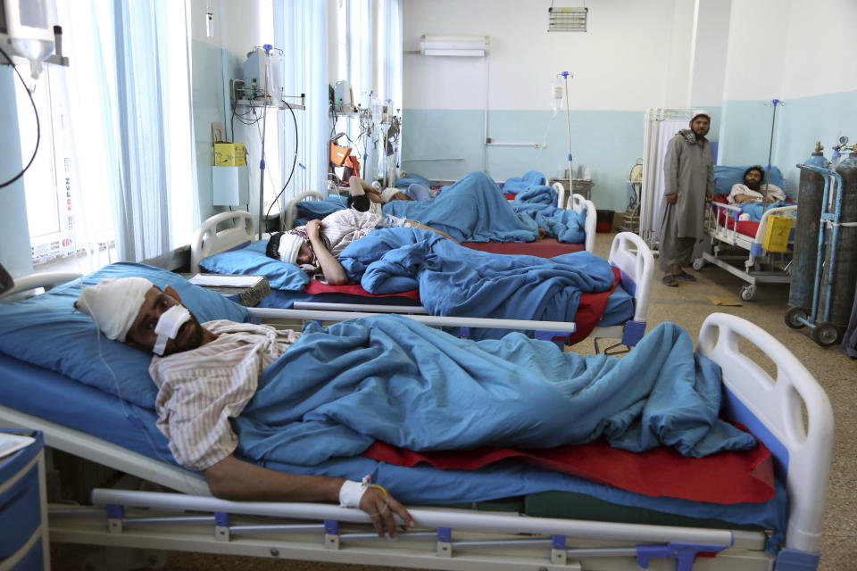 A wounded man receives treatment in a hospital after a bomb explosion during Friday prayer on the outskirts of Kabul, Afghanistan, Friday, May 24, 2019. According to Kabul police chief's spokesman, Basir Mujahid, the bomb was concealed in the microphone used to deliver the sermon. The prayer leader, Maulvi Samiullah Rayan, was the intended target, the spokesman added. (AP Photo/Rahmat Gul)