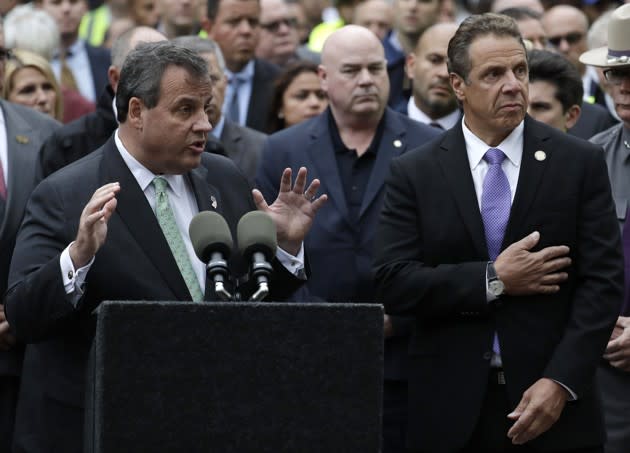 New Jersey Governor Chris Christie speaks next to New York Governor Andrew Cuomo during a news conference about a train crash at the Hoboken Terminal in New Jersey. Julio Cortez / AP