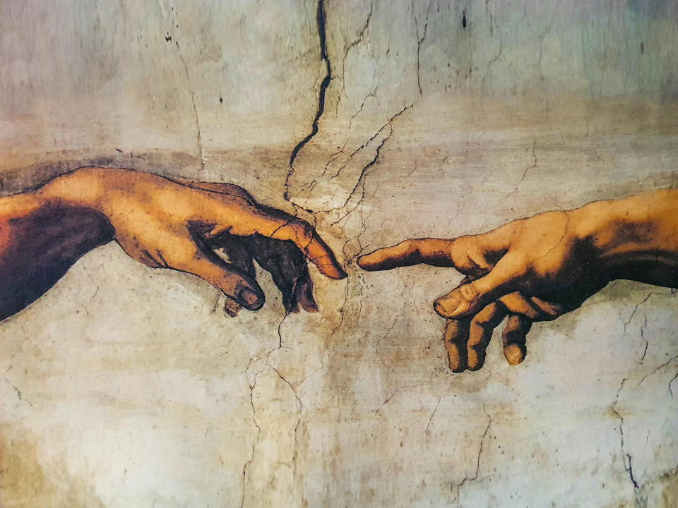 The image shows a famous artwork known as "The Creation of Adam" by Michelangelo, depicting two hands reaching towards each other