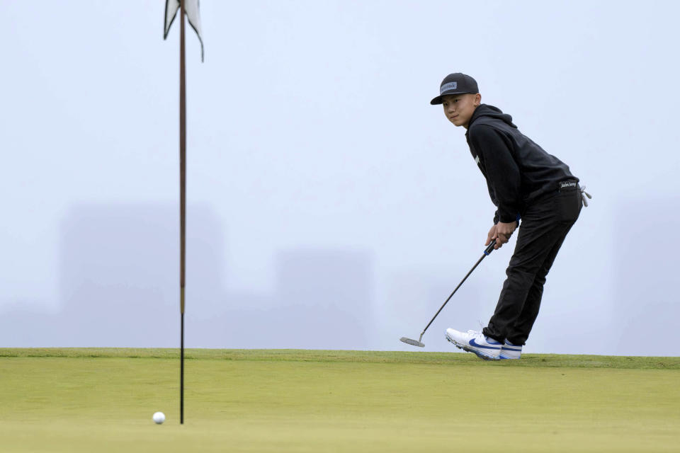 Jaden Soong, 13, reacts after a putt on the fourth hole during the final round of qualifying for the U.S. Open golf championship at Hillcrest Country Club in Los Angeles, Monday, June 5, 2023. (David Crane/The Orange County Register via AP)