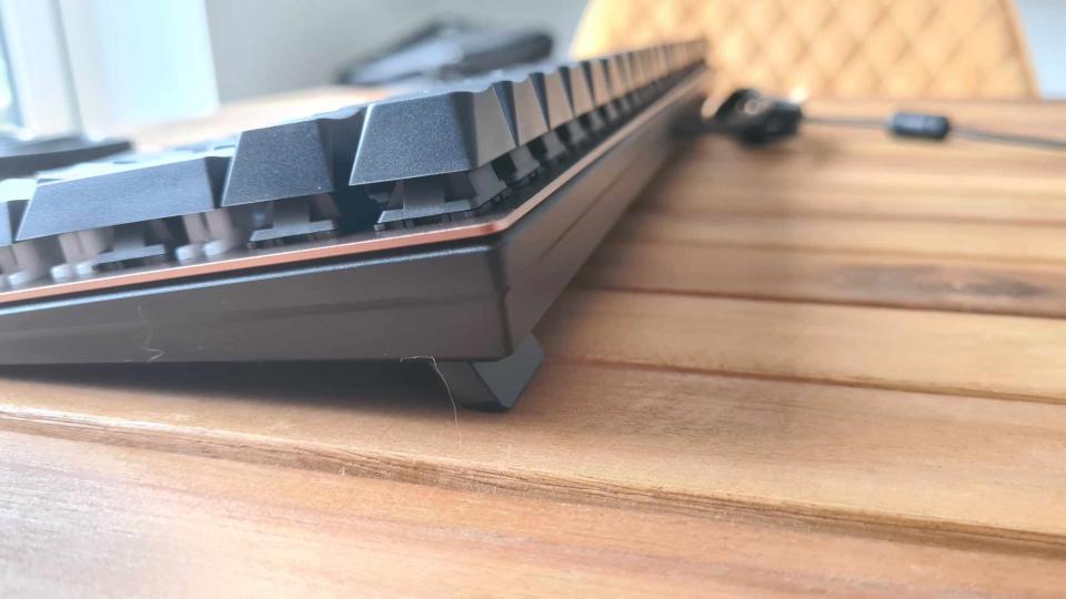 Cherry KC 200 MX gaming keyboard on a wooden table.