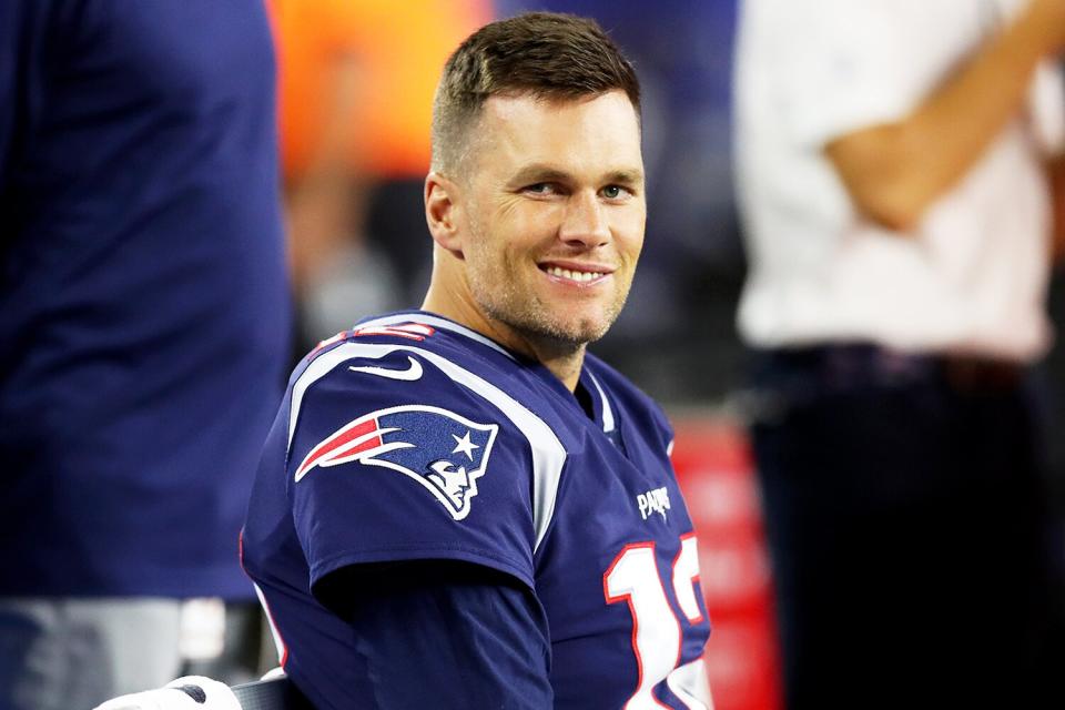 Tom Brady #12 of the New England Patriots looks on from the bench during the preseason game between the New York Giants and the New England Patriots at Gillette Stadium on August 29, 2019 in Foxborough, Massachusetts.