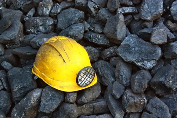 a coal miners helmet on some coal