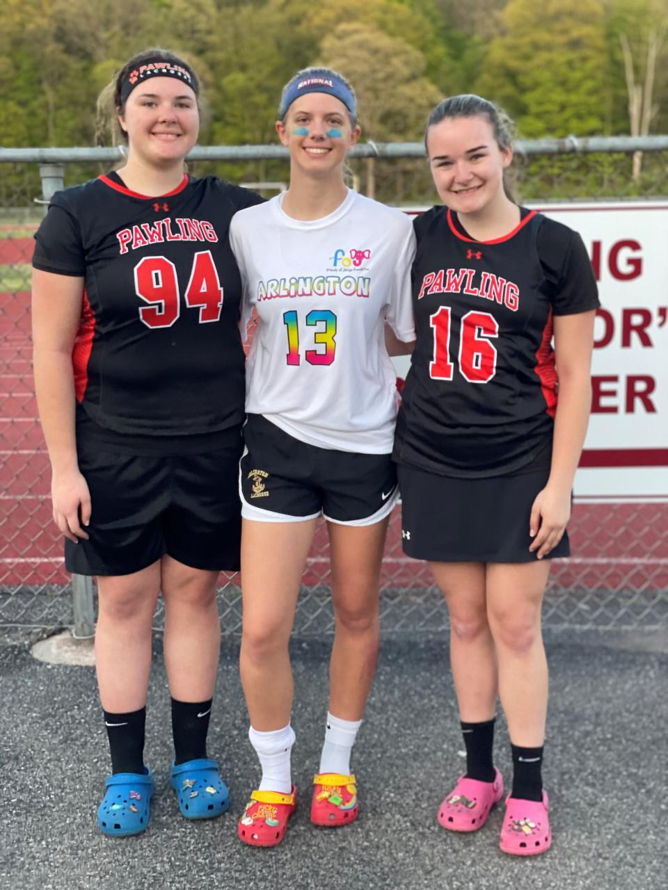 Friends and longtime travel lacrosse teammates pose together after Pawling faced Arlington on Saturday in a Friends of Jaclyn fundraiser game. From left: Lexi Knowles, Talia Berardo and Sarah Knowles.