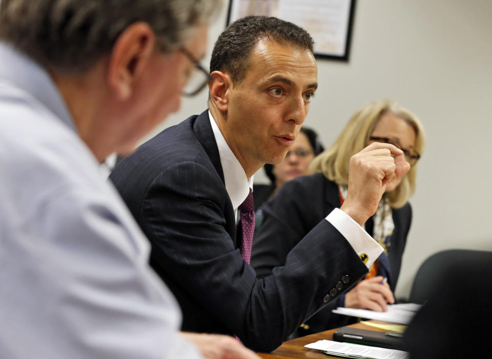 FILE - In this Feb. 4, 2016, file photo, Del. Marcus Simon D-Fairfax, speaks during a meeting of the Privileges and Elections subcommittee at the Capitol in Richmond, Va. A bill making its way through the House would require police chiefs to notify the Criminal Justice Services Board or a civilian review panel if an officer has received three complaints of excessive force in the previous five years. Simon, the bill's chief sponsor, said three complaints would not automatically trigger a decertification hearing, but would act as an "early warning system" to detect a pattern that requires further investigation and could lead to decertification. (AP Photo/Steve Helber, File)