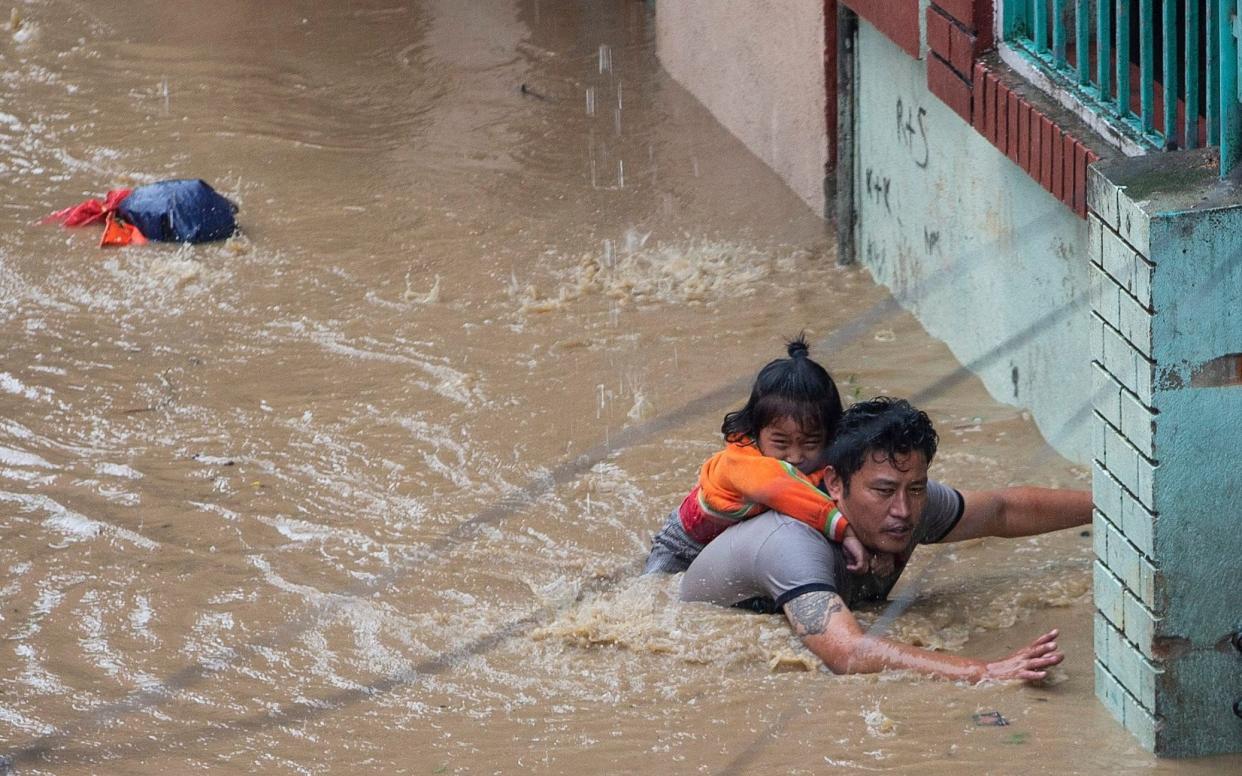 People escaping the floods in Nepal following heavy monsoon rains - REX
