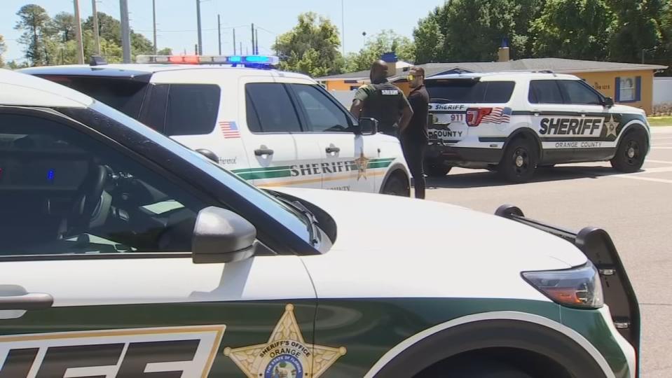 A deputy shot at two armed men during a traffic stop Friday morning in the Pine Hills neighborhood, Orange County Sheriff John Mina said.