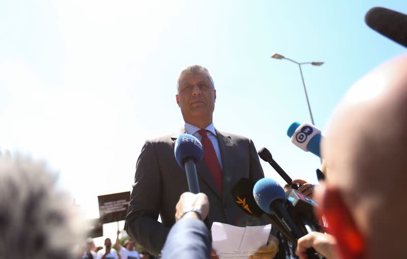 Kosovo's President Hashim Thaci speaks to members of the medis before being interviewed by war crimes prosecutors after being indicted by a special tribunal, in The Hague