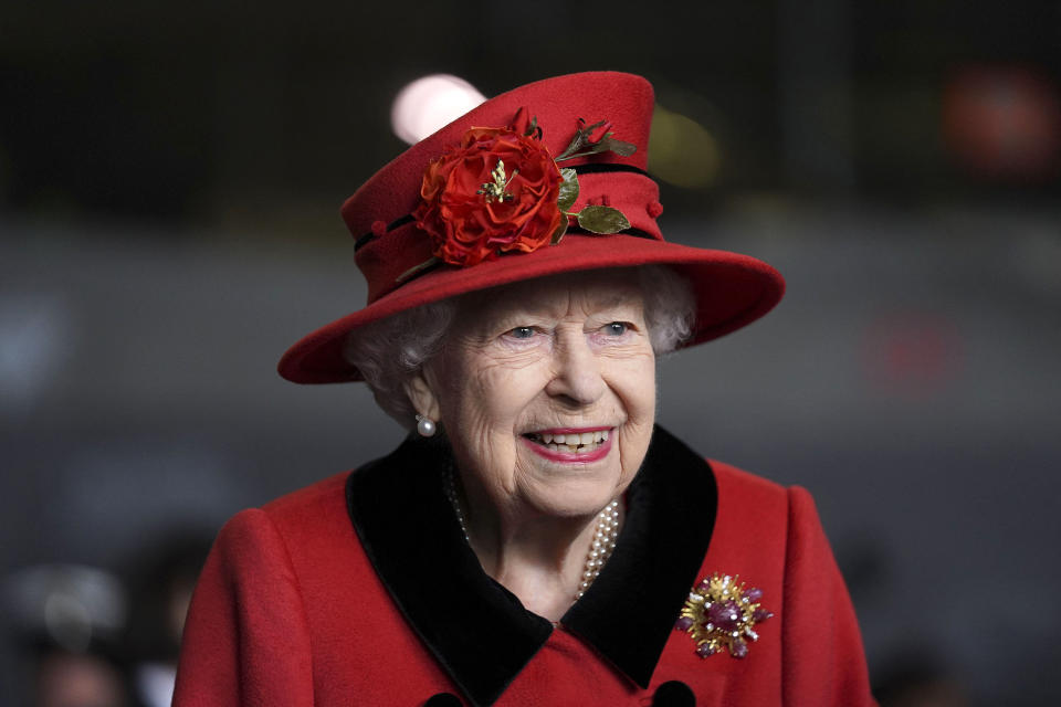 Britain's Queen Elizabeth II reacts during her visit to the aircraft carrier HMS Queen Elizabeth in Portsmouth, southern England on May 22, 2021, ahead of its maiden operational deployment to the Philippine Sea. - The aircraft carrier will embark on her first operational deployment on May 23, leading the UK Carrier Strike Group in engagements with 40 nations including India, Japan, Republic of Korea and Singapore. (Photo by Steve Parsons / POOL / AFP) (Photo by STEVE PARSONS/POOL/AFP via Getty Images)