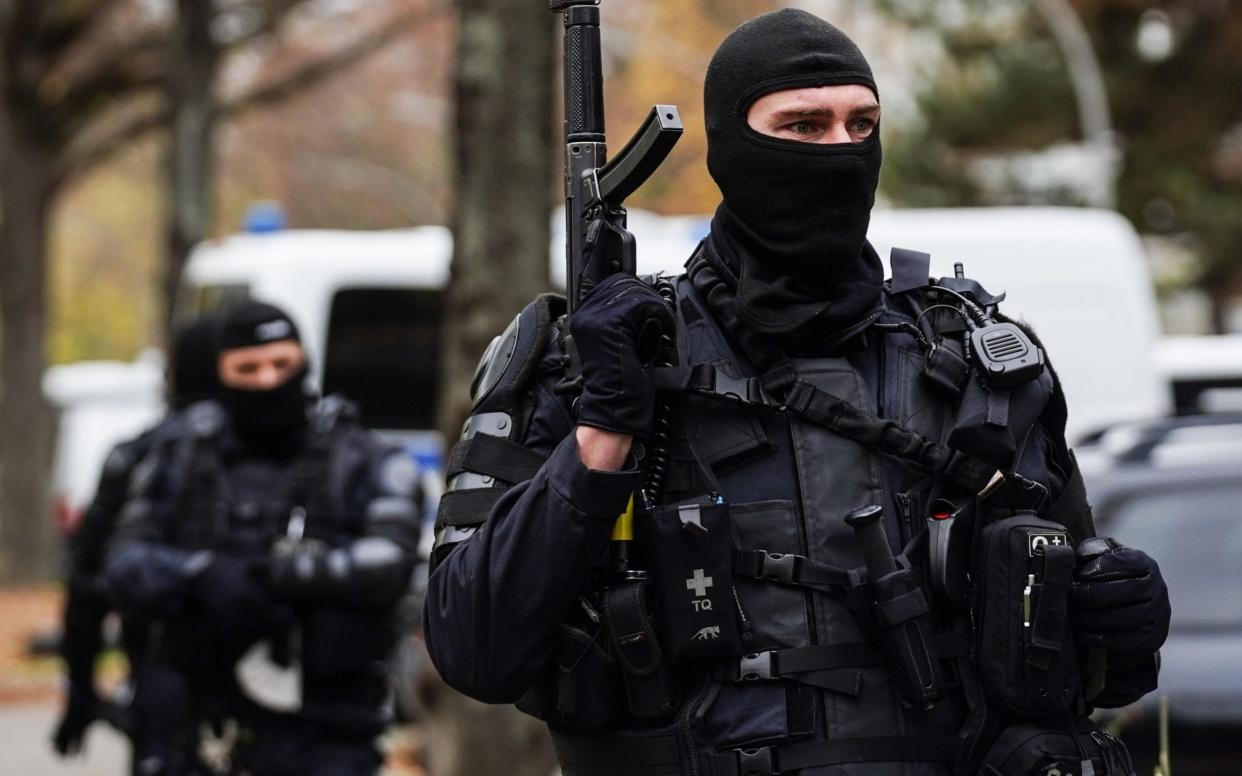 Mandatory Credit: Photo by FILIP SINGER/EPA-EFE/Shutterstock (11019289ai) Police officer with machine gun during a raid linked to the Green Vault (Gruenes Gewoelbe) burglary in the Dresden castle, Berlin, Germany, 17 November 2020. According to media reports, police have arrested three people in relation to the November 2019 robbery of the Dresden's Treasury Green Vault. Police raid linked to burglary at Green Vault in Dresden, Berlin, Germany - 17 Nov 2020 - FILIP SINGER/EPA-EFE/Shutterstock