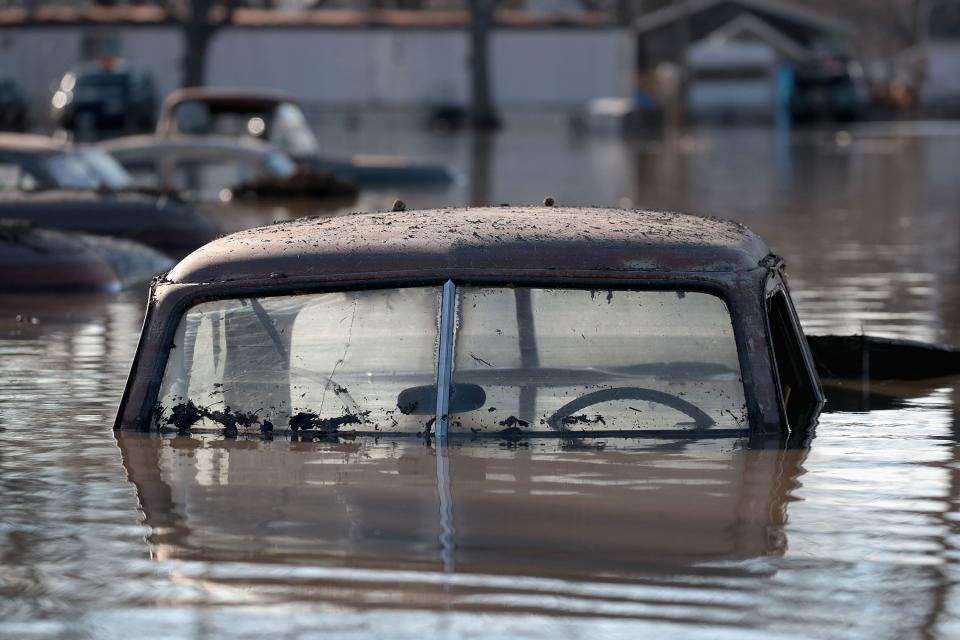 A vintage car sits in flood water on March 20, 2019 in Hamburg, Iowa.