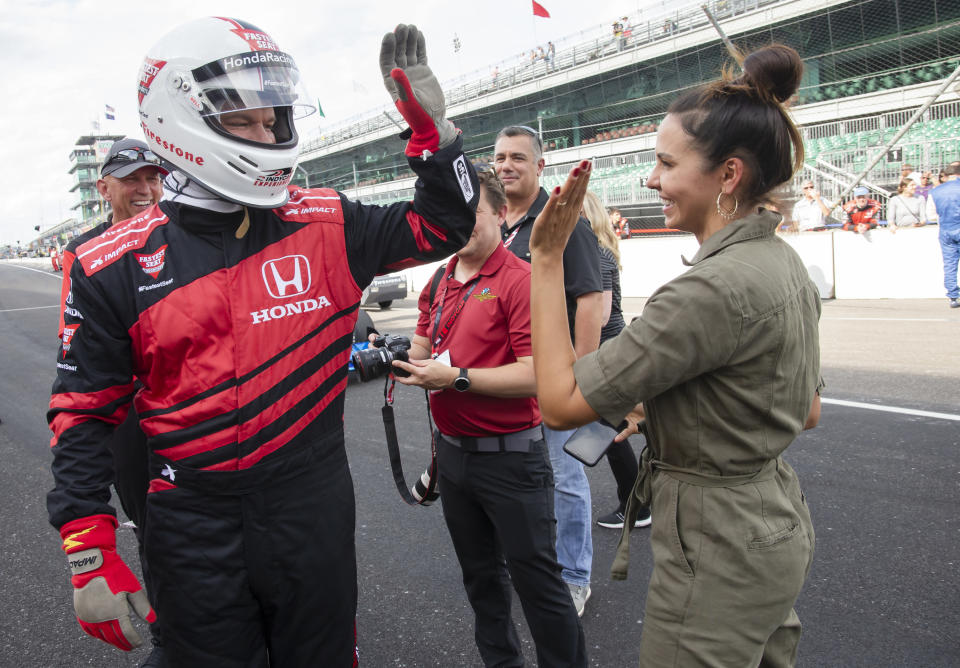 high fiving her after racing a car