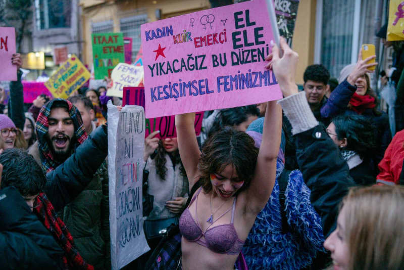 A demonstrator holds a placard during a march from the Cihangir in Taksim, at the Feminist Night March to mark International Women's Day. Tolga Uluturk/ZUMA Press Wire/dpa