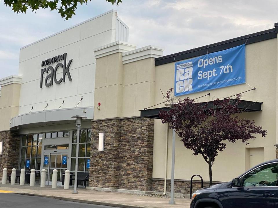 A sign on the Nordstrom Rack building alerts passersby to the opening date.
