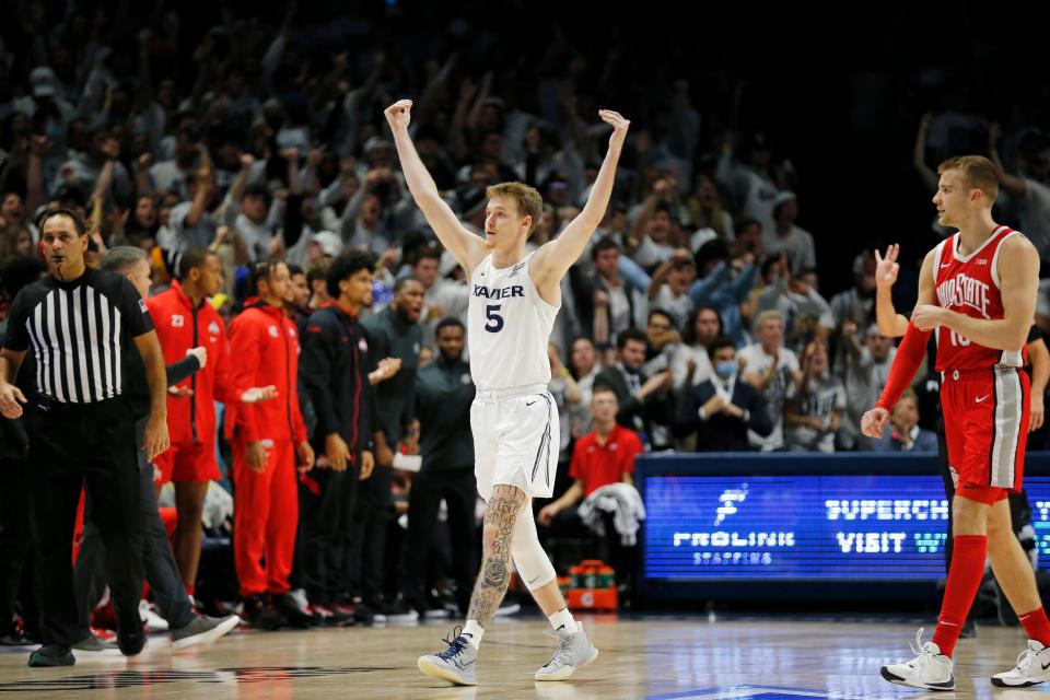 Xavier Musketeers guard Adam Kunkel (5) pumps up the crowd going into a timeout in the second half of the NCAA basketball game between the Xavier Musketeers and the Ohio State Buckeyes at the Cintas Center in Cincinnati on Thursday, Nov. 18, 2021. Xavier defeated the 19-ranked Buckeyes, 71-65.