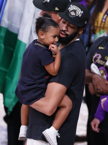 <p>David E. Klutho/Sports Illustrated/Getty </p> Anthony Davis holding his daughter Nala after winning the game and series during the 2020 NBA Finals.