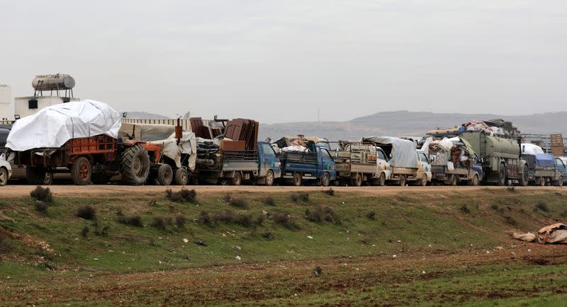 A general view of vehicles carrying belongings of internally displaced Syrians from western Aleppo countryside, in Hazano near Idlib