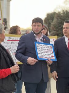  Mark Lee Dickson holds a sign about the Comstock Act in front of the U.S. Supreme Court on March 26, 2024, while justices heard oral arguments in a since-rejected challenge to the abortion pill mifepristone. (Sofia Resnick | States Newsroom)