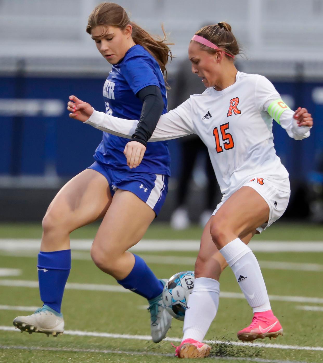 Kohler’s Abbey Janssen (16) is tied up with Cedar Grove-Belgium’s Cora Erickson (15) at Ebben Field, Thursday, May 2, 2024, in Kohler, Wis.