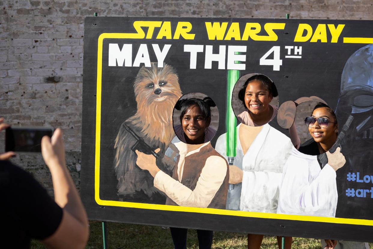 Some "Star Wars" fans have their photo taken in 2022 during a "Star Wars" Festival in Panama City, Fla. during a May the 4th celebration.