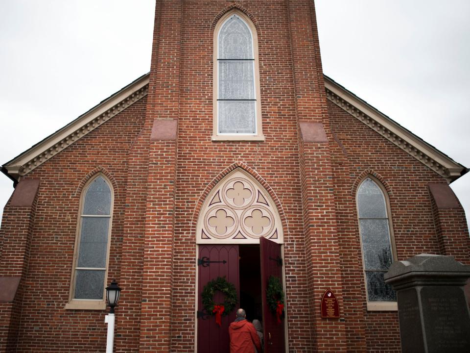 Guests stroll into St. Peter's church in Lewes. The historic churchyard is one of many Lewes places that are mentioned in Rebecca Harding Davis' novel, "Earthen Pitchers."