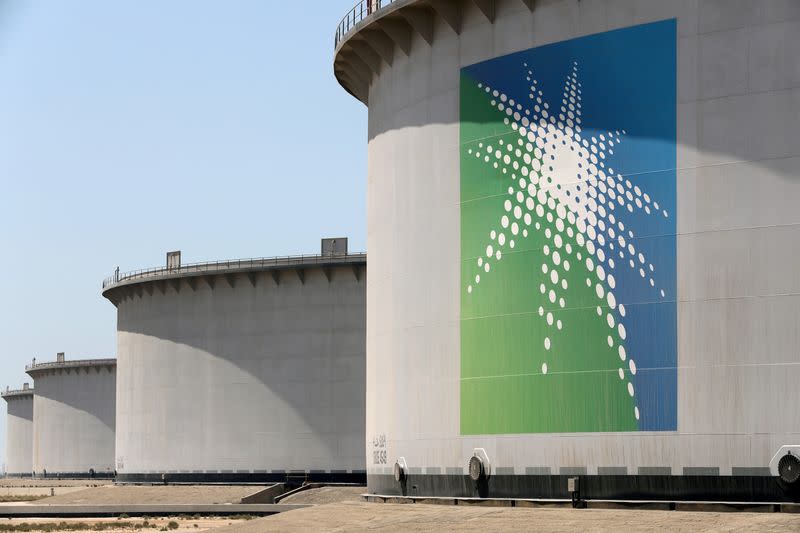 FILE PHOTO: Oil tanks are seen at Saudi Aramco's Ras Tanura oil refinery and oil terminal in Saudi Arabia