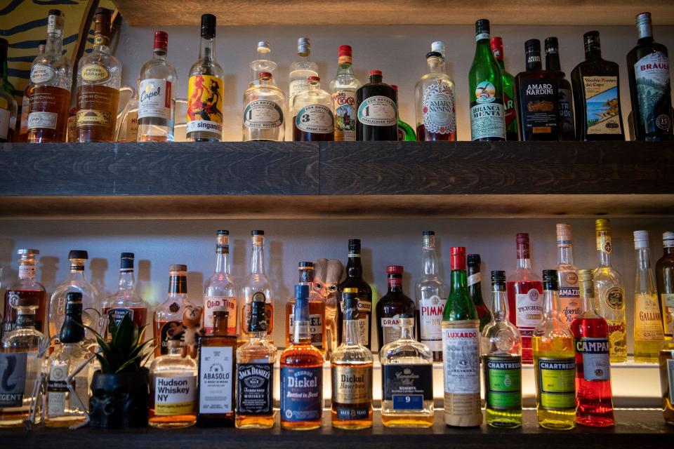 Bottles of liquor on shelves behind the bar at Golden Pineapple, November 2, 2023.