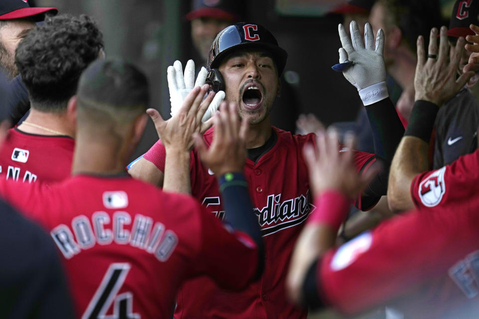 Cleveland Guardians' Steven Kwan celebrates in the dugout after hitting a home run against the Seattle Mariners during the second inning of a baseball game Wednesday, June 19, 2024, in Cleveland. (AP Photo/Sue Ogrocki)