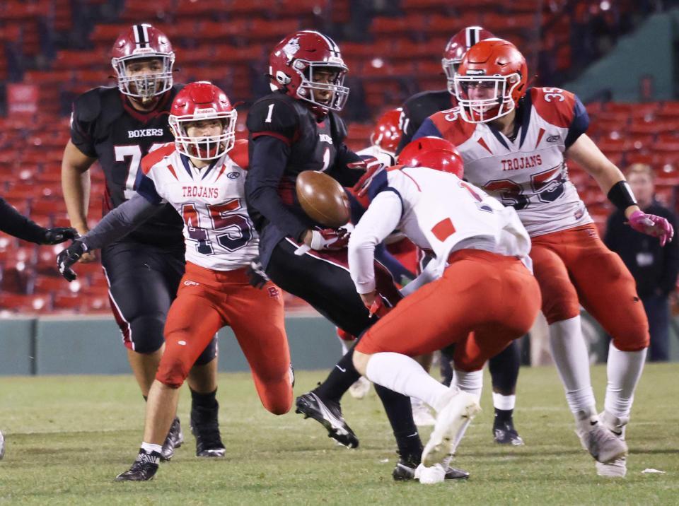 Brockton's Cameron Monteiro carries the football during a game at versus Bridgewater-Raynham at Fenway Park on Wednesday, Nov. 23, 2022.   