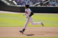 Atlanta Braves' Adam Duvall rounds the bases after hitting a two-run home run during the eighth inning against the Cincinnati Reds in Game 2 of a National League wild-card baseball series, Thursday, Oct. 1, 2020, in Atlanta. (AP Photo/John Bazemore)