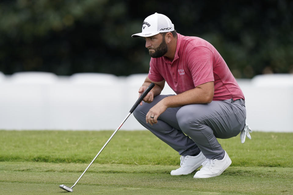 Jon Rahm looks over his putt on the second hole during the final round of play in the Tour Championship golf tournament at East Lake Golf Club, Sunday, Sept. 5, 2021, in Atlanta. (AP Photo/Brynn Anderson)