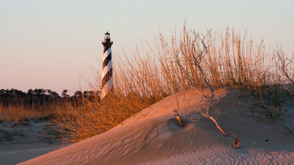 The water is still warm in early fall and the summer crush recedes on North Carolina's Outer Banks. Cape Hatteras Lighthouse is pictured. - mdulieu/iStockphoto/Getty Images